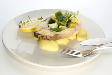 carp fillet on organic potato and lemon