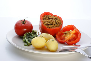 Red mince filled paprika with potato and tomato