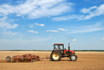 Agriculture ploughing tractor outdoors