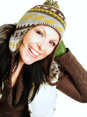 closeup of smiling brunette woman in winter clothes