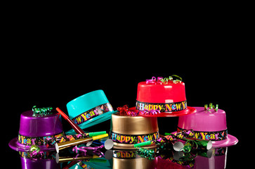 New Years' Eve party hats on  black background