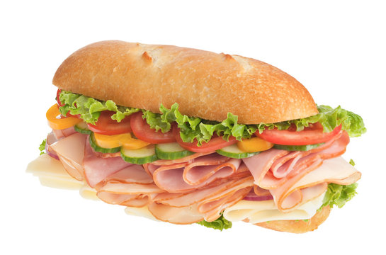 Large ham & turkey submarine sandwich on white