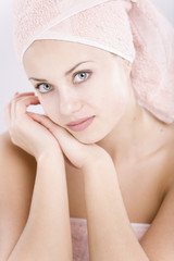 gentle young woman with towel on her head