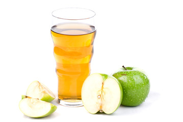 A glass of apple juice whith apples isolated on white
