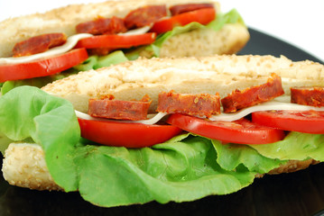 sandwich with sausage and salad close detail