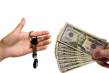 female hand with keys and male hand with money