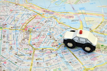 Police car on the map of the city