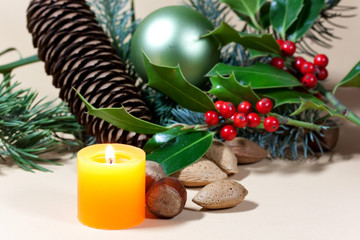 Christmas candles and baubles on background
