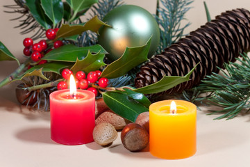 Christmas candles and baubles on background
