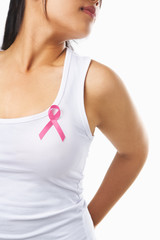 Woman using pink ribbon on her chest to support breast cancer ca