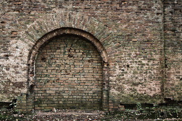 Old brick wall with arc