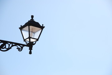 Fototapeta na wymiar Old lantern with sky background