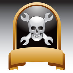 Skull and crossed wrenches in gold displaya