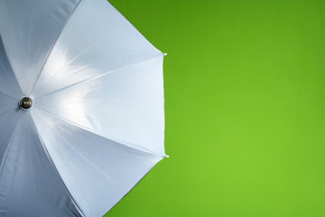 white umbrella on a green background