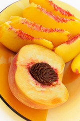 Sliced peaches in a glass plate
