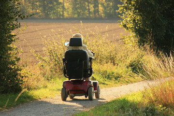 pensioner with elektric wheelchair