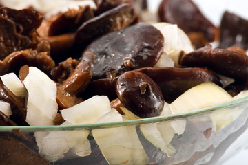 Salted mushrooms in glass dish