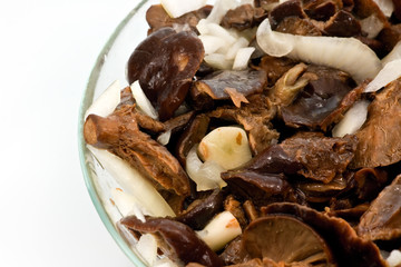 Salted mushrooms in glass dish