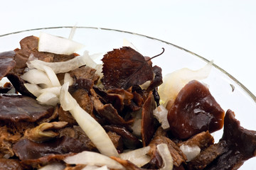Salted mushrooms in glass dish