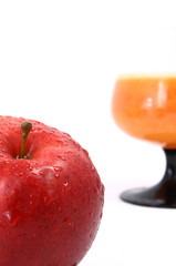 Apple juice with apple near