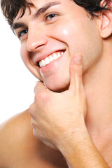 Happy cleanshaven male face with a toothy smile
