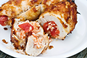 Macro of crusty chicken roulade stuffed with spanish rice.