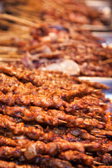 Roasted meat on wood sticks