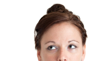 Fototapeta premium portrait of a beautiful girl looking up into the space above her