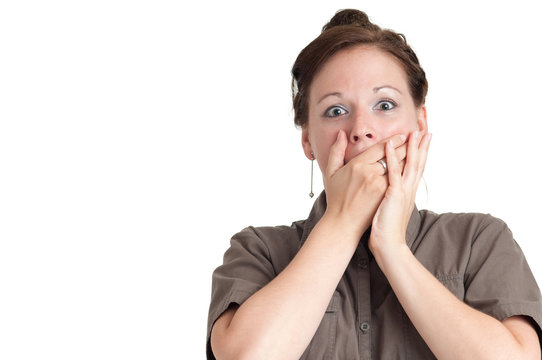 surprised young woman with both hands placed over the mouth