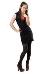 Playful pretty girl in black dress. Isolated