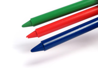 RGB color crayons on white background