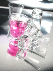 Cherry cocktail shot on silver floor