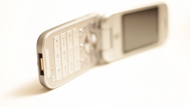 Rotating cellular phone on white