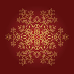 Detailed golden snowflake on red background