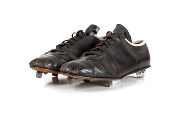 Baseball cleats on a white