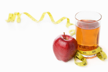 Red apple and jiuce with measuring tape