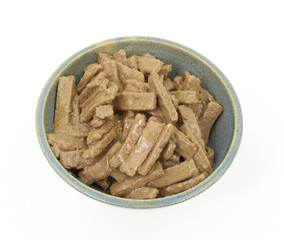 Generic dog food in a stoneware bowl