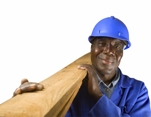 Senior African plumber, carpenter or builder with wooden planks