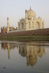 Fototapeta na wymiar Taj Mahal reflected in the River Yamuna at sunset