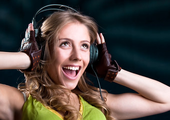 Young woman in headphones singing