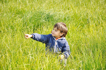 Happy childhood on green beautiful meadow