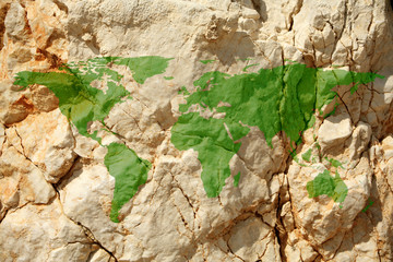 conceptual image of rock with flat world map