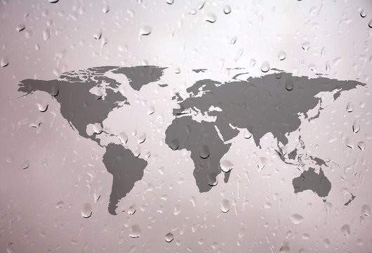 close up shot of water droplets with world map