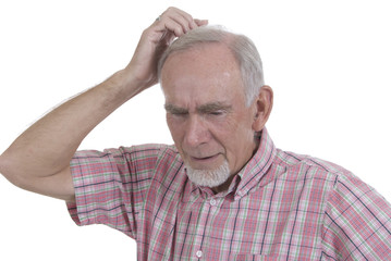 Old man scratching head puzzled