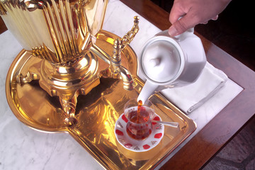 close up shot of a semovar with teacup