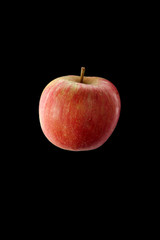 Red apple on black background