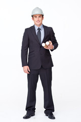 Standing attractive businessman against white