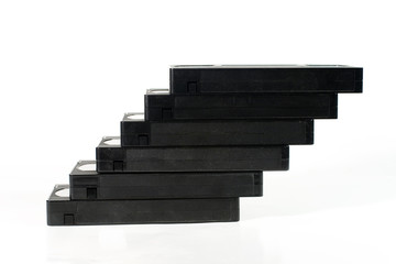 “Staircase” of old video tapes (on a white background)