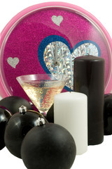 christmas balls and champagne with colorful clock at midnight