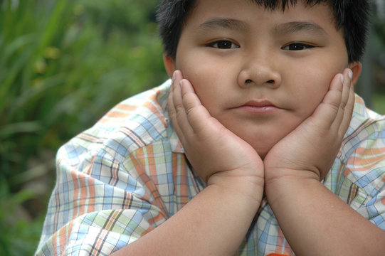 little boy get laying in the park